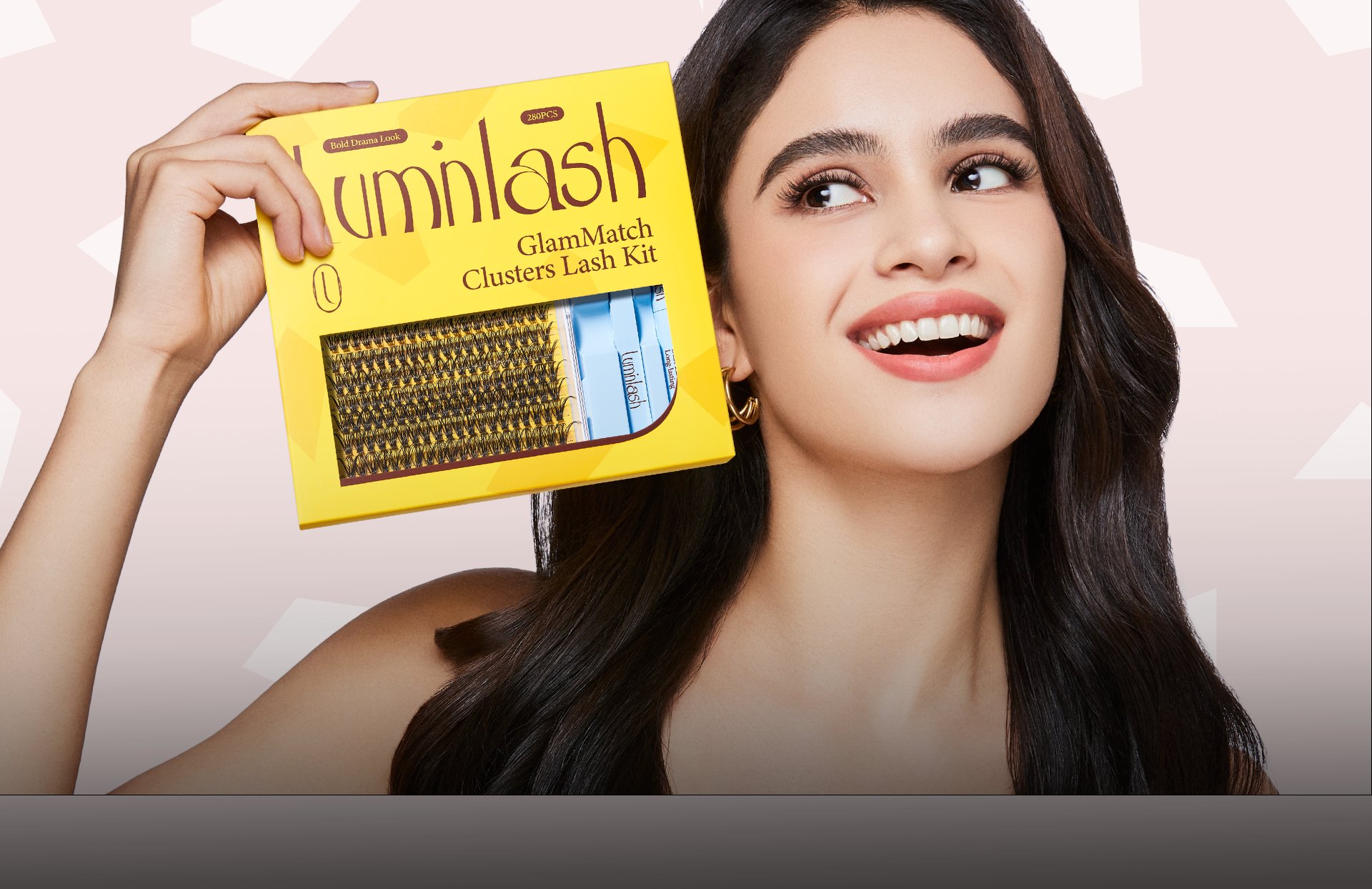 Luminlash lashes on a model with pink backdrop