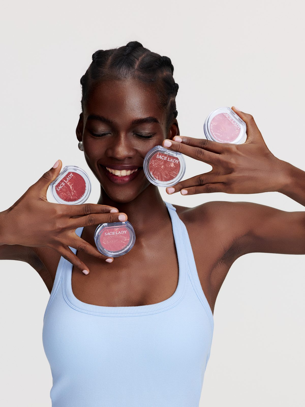 SACE LADY model holding powder compacts