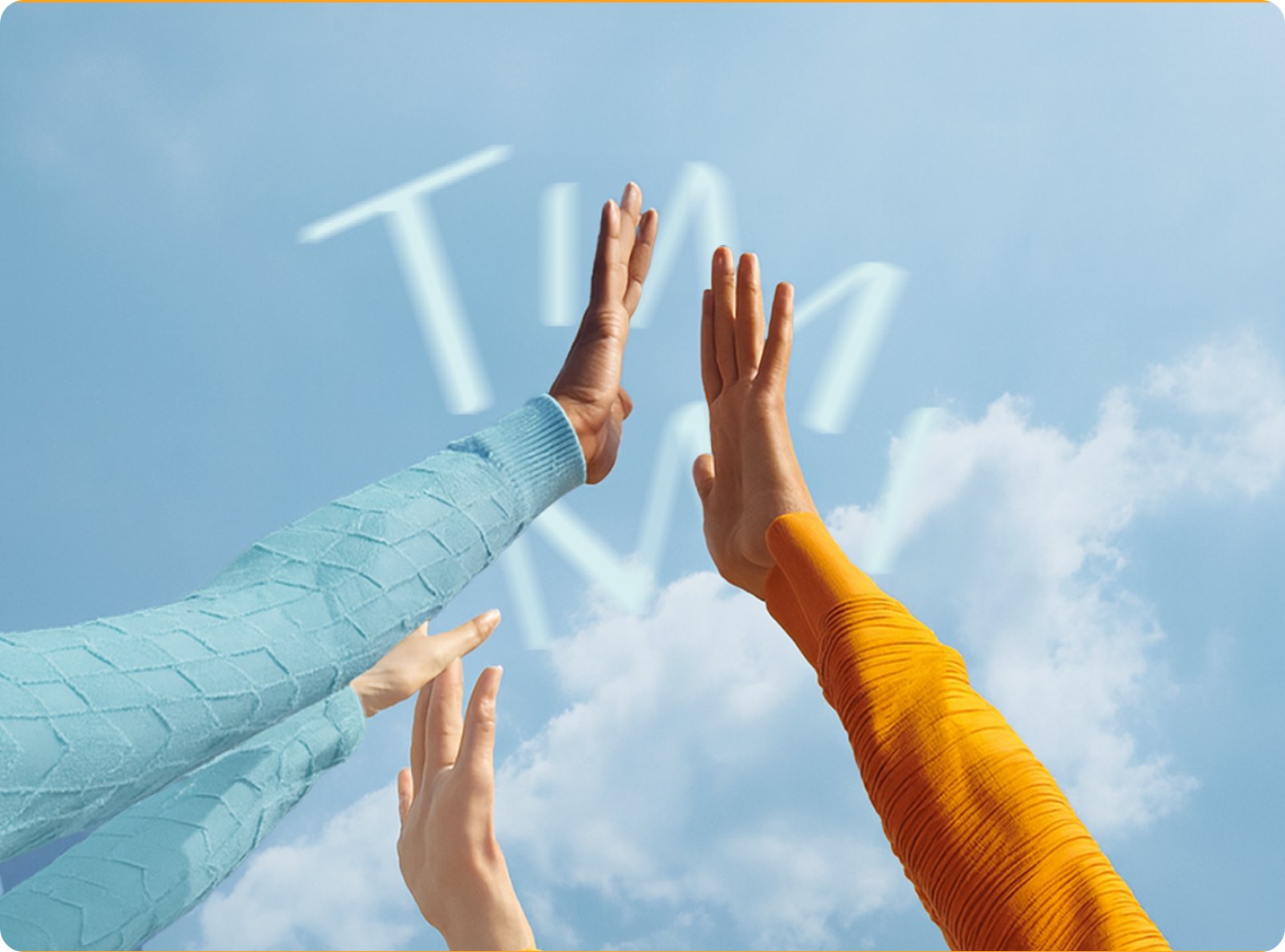 Arms raised against a blue sky