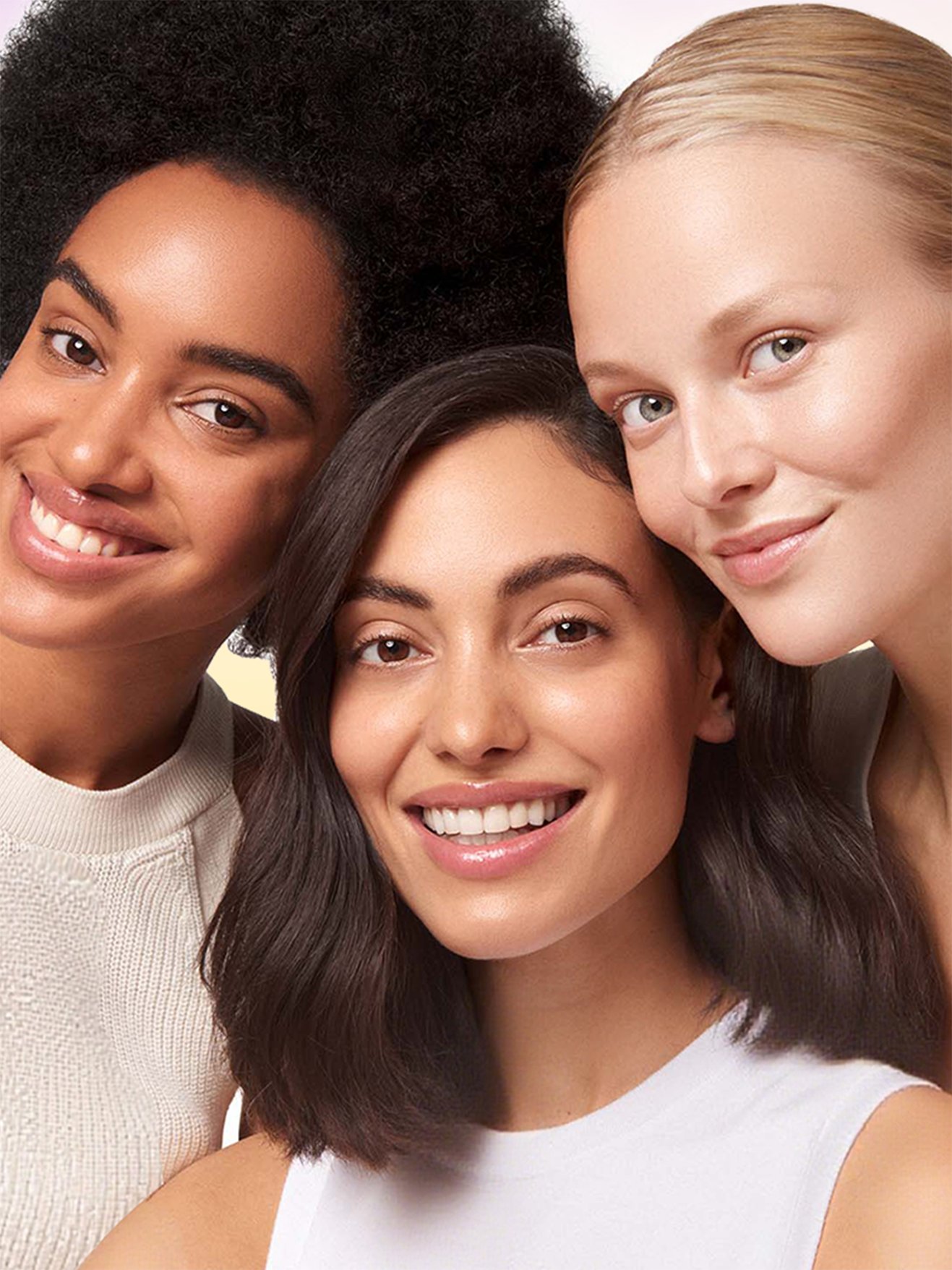 Three women smiling together