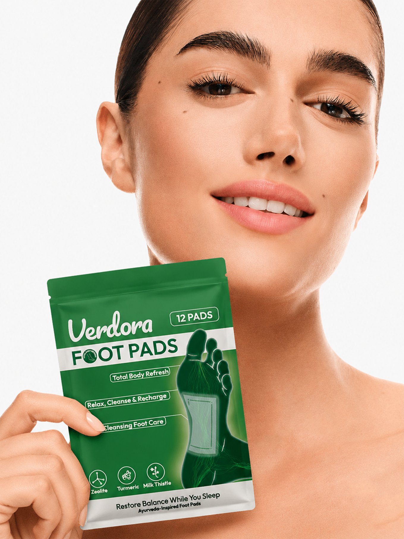 Woman holding Verdora foot pads